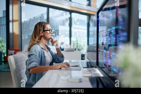 Data Scientist Analyzing Neural Network Models Using Advanced AI Tools. Stock Photo
