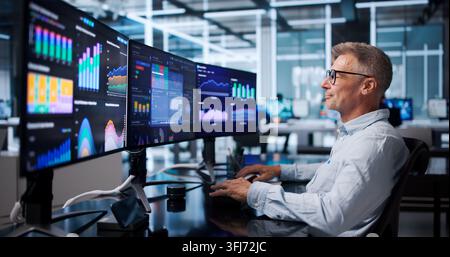Financial Analyst Reviews Dashboard Carefully, Interpreting Data For Informed Decisions. Stock Photo