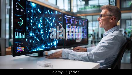 Data Scientist Analyzes Data On Desktop, Building AI Models For Predictive Analytics. Stock Photo