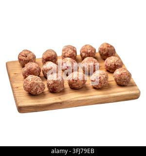 Raw meatballs on wooden board Stock Photo