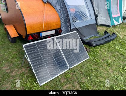 Portable Solar Panel for Electricity While Camping Outdoors Stock Photo