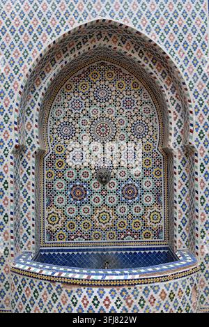 Traditional Moroccan zellij tile fountain in Marrakesh, Morocco Stock Photo