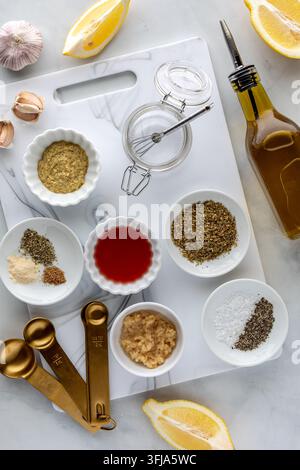 Above view of various ingredients used for making a Greek chicken marinade. Stock Photo