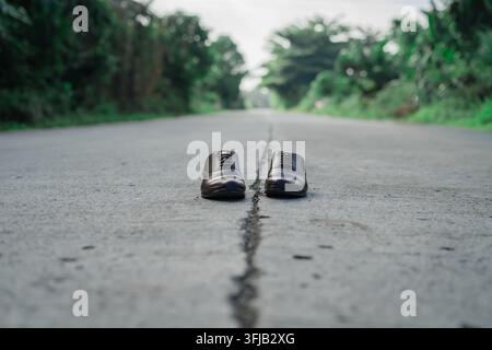 Men's Formal Leather Shoes Placed on an Asphalt Road Stock Photo