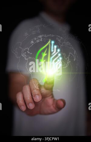 Finger touches hybrid leaf and digital circuit board inside earth globe outline. Activation of eco-friendly green technology, sustainable digital inno Stock Photo
