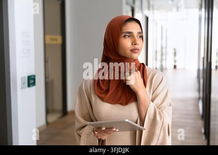 Indian businesswoman office employee thinking on strategy in office Stock Photo