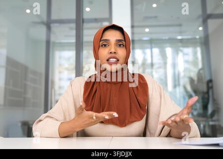 Indian businesswoman presenting ideas during corporate virtual meeting Stock Photo