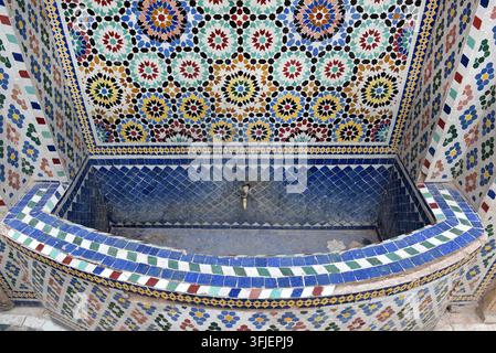Traditional Moroccan zellij mosaic fountain detail in Marrakesh, Morocco Stock Photo