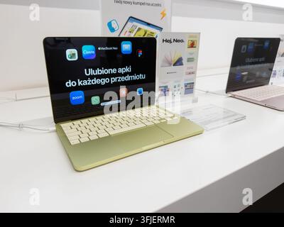 Poznan, Poland - September 19, 2026: MacBook Neo computers featured in a technology store exhibit, where sleek hardware and digital interface displays Stock Photo