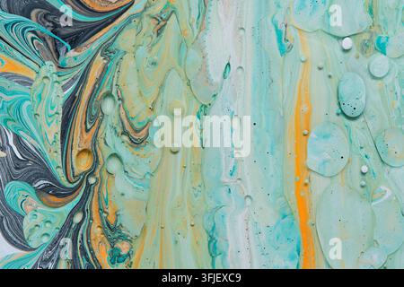 Detailed fluid acrylic background combining dark marble swirls and light mint green tones Stock Photo