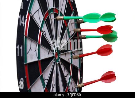 Red and green dart arrow hit the Board. Isolated on white. Stock Photo