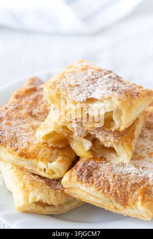 Home-made apple turnover (apple pieces cooked with cinnamon and suger, backed in puff pastry) - macro shot Stock Photo