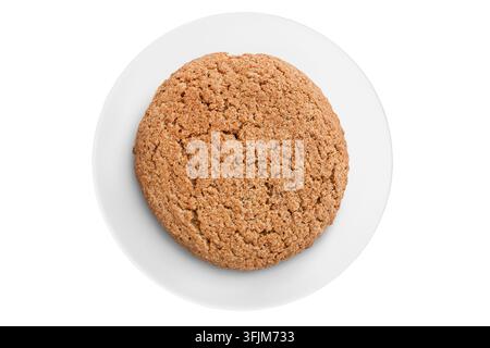 One oatmeal cookie on white ceramic dish isolated on white background Stock Photo