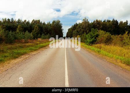 Scenic route on an asphalt road through an autumn landscape with copy space. Stock Photo