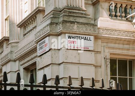 London, England, United Kingdom, August 14, 2026. Close-up view of Whitehall SW1 and Downing Street SW1 street signs mounted on stone corner building Stock Photo