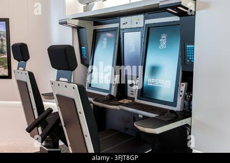 Operator workstation inside a NASAMS air defence command and control system, with display screen and operator chair. Paris, France - June 17, 2025 Stock Photo