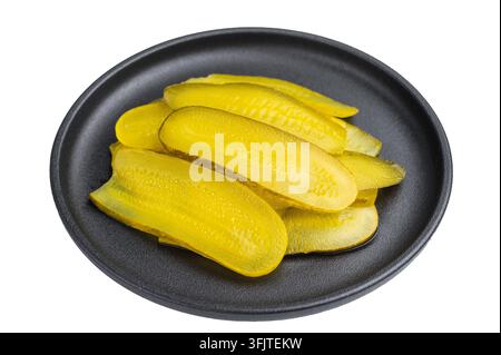 Fresh crunchy pickle slices stacked on a dark plate with white background, vibrant preserved cucumbers in top view Stock Photo