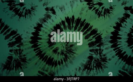 Green tie dye background featuring a central black spiral and abstract dark patterns, creating a vibrant, psychedelic aesthetic. Stock Photo