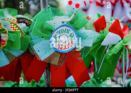 San Pedro Cholula, Mexico - September 8, 2026: Green, white and red decorations with a Viva Mexico emblem displayed at the traditional barter fair. Stock Photo