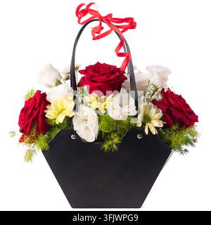 Red roses white eustoma and yellow chrysanthemums floral arrangement in black gift bag isolated on white background Stock Photo