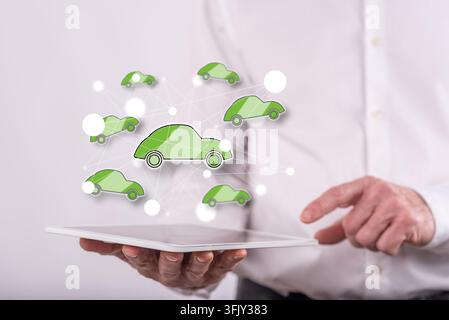 Connected car concept above a tablet held by a man in background Stock Photo