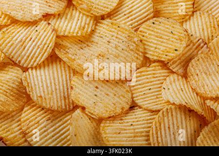 Lots of potato chips, texture close up Stock Photo