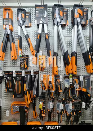 Kiel, Germany - 27. July 2026: Fiskars gardening tools and equipment hanging on a pegboard in a hardware store Stock Photo