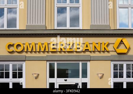 The Commerzbank name and yellow logo are displayed above the entrance ...