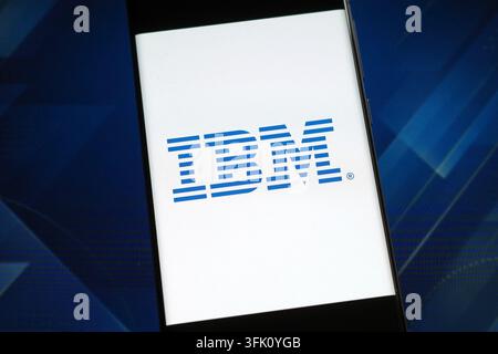 IBM logo displayed on a smartphone screen. IBM is a global technology company providing software, cloud, AI and consulting services Stock Photo