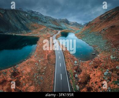 Aerial view of mountain road between two lakes in alpine valley Stock Photo