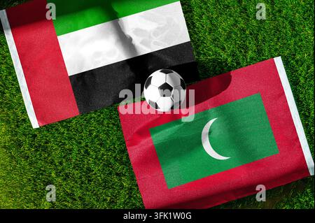 United Arab Emirates and Maldives flags waving on isolated white ...