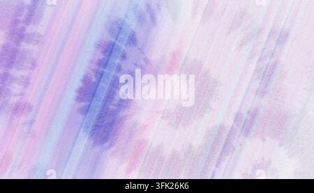A soft, light-colored fabric texture showing a diagonal tie-dye pattern in shades of pink, purple, and blue with a subtle woven grain. Stock Photo