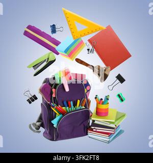 School bell and stationery flying over backpack against color gradient background Stock Photo