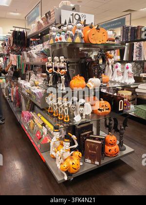 Pforzheim Germany August 28, 2026 Halloween themed store display shows pumpkins, skeleton figurines, ghost ornaments, bats, books, candles, and season Stock Photo