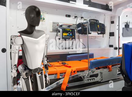 Humanoid robot inside modern emergency medical ambulance Stock Photo