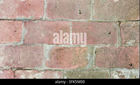 Old weathered brick wall in soft pastel pink and gray tones, Switzerland Stock Photo