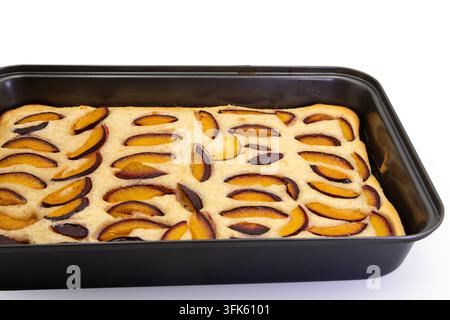 Homemade Plum Cake Baked in a Rectangular Pan on White Stock Photo