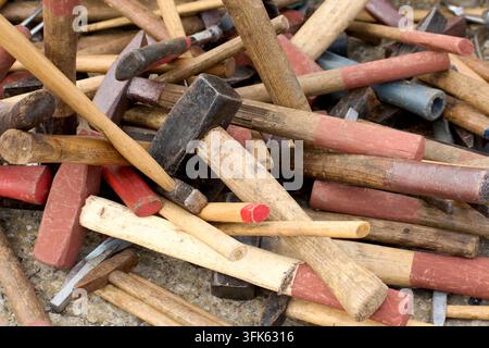 Hammers of various colors and sizes for sale on a stall at a flea market Stock Photo