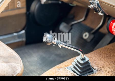 Close-up of manual gear shifter in vintage car interior Stock Photo