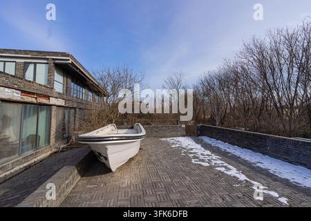 White boat parked on the rooftop terrace of Red Brick Art Museum, Beijing Stock Photo