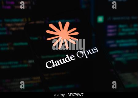 Paris, France - 23 September 2026 : Close-up of Claude Opus AI logo with source code background lines. Stock Photo
