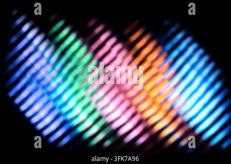 Abstract light pattern with colorful glowing stripes, optical effects and light beams on a dark background, digital technology texture. Stock Photo