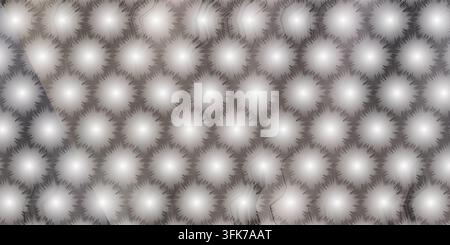 A digital illustration featuring a repeating pattern of luminous, spiky circular orbs set against a subtle, soft grey gradient background. Stock Photo