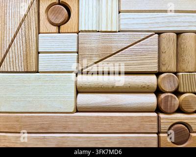 Wooden building blocks form a geometric pattern, representing construction and creativity Stock Photo