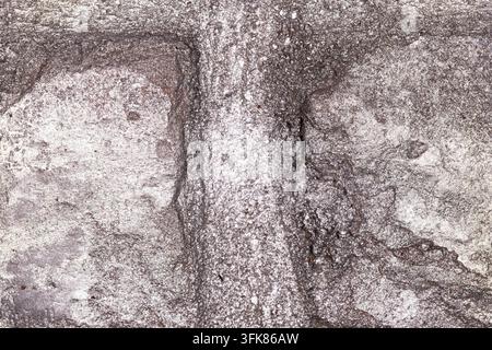 Close-up of a metallic stone texture with silver tones and rough surface patterns suitable for backgrounds and design work. Stock Photo