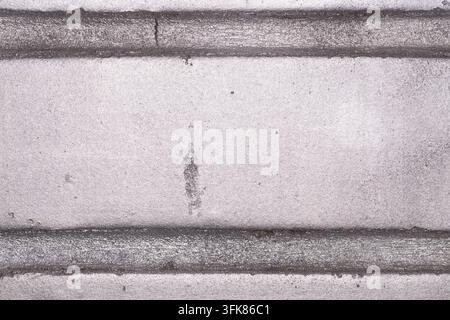 Close-up of a metallic stone texture with silver tones and rough surface patterns suitable for backgrounds and design work. Stock Photo