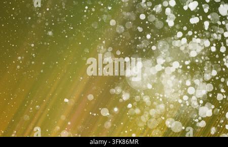 A beautiful abstract background featuring glowing white bokeh particles and soft light streaks against a warm, textured green backdrop, perfect for cr Stock Photo