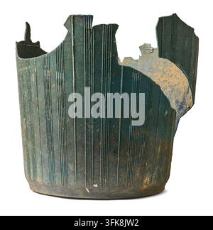 broken old plastic bucket isolated white background, dirty weathered dark green ribbed container with missing pieces, side view Stock Photo