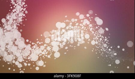 Abstract composition with glowing white bokeh particles flowing across a vibrant, multicolored gradient background with texture. Stock Photo