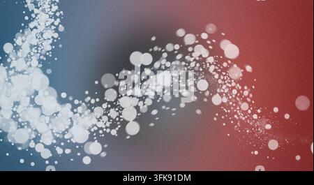 Abstract design featuring a wavy trail of glowing white bokeh light particles against a textured gradient background with blue and red tones. Stock Photo